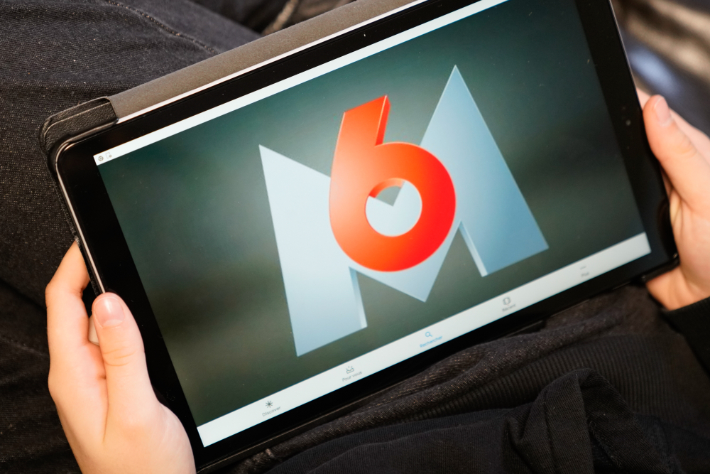 M6 logo - golden moustache